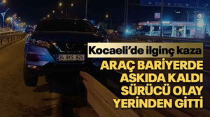 Araç bariyerde askıda kaldı, sürücü olay yerinden gitti